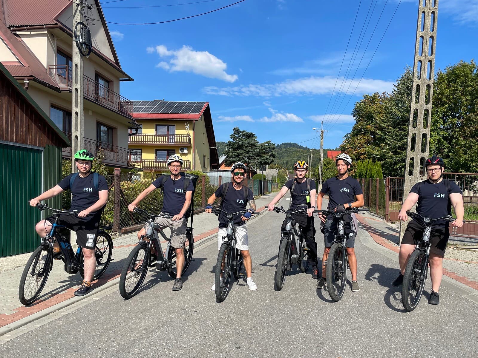 The team on an e-bike ride during an offsite